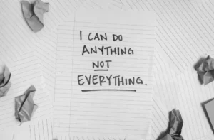 Motivational quote on crumpled paper.