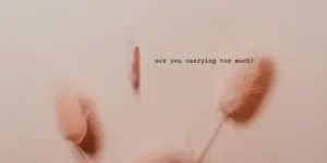 Soft pink background with text and flowers.